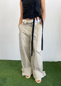 Our wide leg belted trouser with contrast stitching details. Features 5 different pockets, a buttoned adjustable tapered bottom option and a folded length adjustable button option. There are endless ways to wear these pants; we love a versatile piece! Belted Trousers, Leg Belt, Stitching Details, Tapered Trousers, Tall Clothing, Trouser Style, Pocket Pants, Fashion Books, Love A