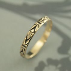 "Gold Antiqued Ring~Gold Wedding Band~Orange Blossom Ring~Romance Band~Antiqued Gold Band~Black Gold Ring~Women Gold Ring~Vintage Style Ring Introducing our new ANTIQUED Gold Bands! This solid 14K gold ring is hand crafted from preformed pattern wire. It features a lovely floral design and can be custom made in any ring size. The detail is so exquisite it looks as if it was hand engraved! Measuring 2.8mm (just under 1/8\") wide and a slim .75mm thick, it is perfect as a petite wedding ring or st Antique Finish Rings For Anniversary, Antique Finish Anniversary Jewelry Ring, Heirloom Rings With Antique Finish For Anniversary, Heirloom Style Antique Finish Rings For Anniversary, Adjustable Antique Finish Wedding Jewelry, Antique Finish Adjustable Wedding Jewelry, Vintage Flower Ring With Intricate Design For Promise, Victorian Engraved Rings For Marriage, Vintage Wedding Rings With Decorative Band