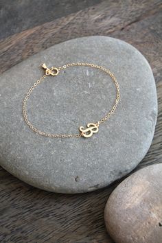 A dainty 14k gold filled bracelet with a script-letter initial, attached sideways on a shimmering chain, with a little teardrop charm by the clasp. Please select initial and size from the drop down menus. Available in the following letters only: A B C D E F H J K L M N P R S Y Components: Script letters - 14k gold filled, aprox 10x8mm each Chain - 14k gold filled Your item will arrive in a beautifully embossed Jewelry box - Ready for gift giving! Custom Name Adjustable 14k Gold Jewelry, Personalized Initials Bracelet Jewelry, Adjustable Everyday Jewelry With Initials, Everyday Adjustable Jewelry With Initials, Adjustable Monogrammed Gold Jewelry, Dainty Adjustable Jewelry For Personalized Gift, Adjustable Dainty Jewelry For Personalized Gift, Delicate Adjustable Jewelry For Personalized Gifts, Adjustable Initials Pendant Jewelry