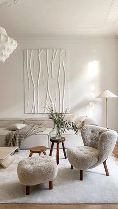 a living room filled with furniture and white walls