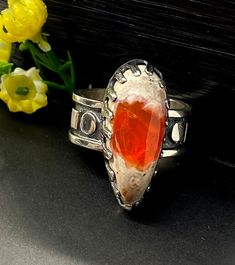 Mexican Fire Opal ring in sterling silver Hand-made Sterling Silver 925, size 10 Stones used: Mexican Fire Opal Face of the ring: Height-28mm, Width-11mm, Band-10mm Unique Handcrafted One-of a-kind Design Ring Each Piece of Jewelry in my Collection is Absolutely One of a Kind! When you start wearing a piece of my jewelry you will fall in love with it more and more each day and feel that good Energy and Love that I pass into it while creating this piece of Art. A piece of Art created for you to b Unique Untreated Ring Jewelry, Unique Untreated Open Ring, Handmade Southwestern Silver Opal Ring, Southwestern Style Rings With Polished Finish, Handmade Silver Opal Ring In Southwestern Style, Artisan Sterling Silver Ring With Polished Finish, Untreated Sterling Silver Rings - Fine Jewelry, Handmade Southwestern Opal Ring, Artisan Red Sterling Silver Rings