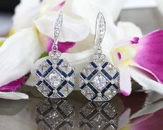 Vintage Art Deco Earrings, Drop Dangle Diamond Earrings, Round & Sapphire Diamond Antique Edwardian 14K White Gold Over Earrings 1920's Item Description: Main Stone Shape: Round Cut Stone: Cubic Lab Created Metal Customization: 1. White Gold: 10K/14K/18K 2. Yellow Gold: 10K/14K/18K 3. Rose Gold: 10K/14K/18K 4. Silver: Sterling Silver 925 Main Stone: Cubic Zirconia, Moissanite, Natural Diamond, CVD Diamond * Check out Special Notes: At checkout, leave us a note in the message box for the Ring Art Deco Sapphire Earrings, Art Deco Diamond Cut Earrings For Wedding, Art Deco Diamond Cut Wedding Earrings, Art Deco White Gold Earrings For Gift, Art Deco Round Earrings For Wedding, Art Deco Round Wedding Earrings, White Gold Art Deco Wedding Earrings, Art Deco White Gold Wedding Earrings, Art Deco Drop Earrings For Anniversary