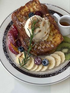 french toast with fruit and ice cream on a plate