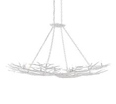 a white chandelier with branches hanging from it's sides and two lights on each side