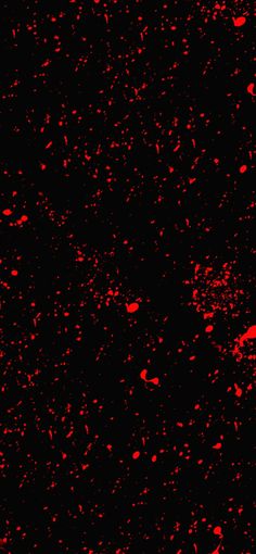 red paint splattered on black background