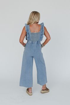 You're going to love the Tiffany Ruffled Denim Jumpsuit. Whether you're running errands or catching up with friends, these overalls will keep you stylish and confident all day long! Comfortable, Cotton denim fabric Relaxed jumpsuit silhouette at ankle length Flattering square neckline and tank straps with exaggerated ruffle trim Pleated details along the bodice, side zipper closure and elastic square smocked panel along the back Gathered center seam at waist line creating beautiful pleating Loos Medium Wash Overall Jumpsuits And Rompers For Day Out, Medium Wash Overall Jumpsuit For Day Out, Light Wash Denim Overall Jumpsuit For Day Out, Spring Medium Wash Overall Jumpsuits And Rompers, Spring Light Wash Overalls For Day Out, Spring Day Out Denim Overalls, Spring Denim Overalls For Day Out, Spring Day Out Medium Wash Overalls, Spring Denim Overall Jumpsuit In Medium Wash