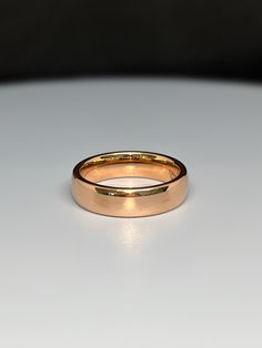 a close up of a wedding ring on a table