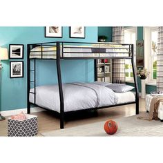 a bunk bed in a room with blue walls