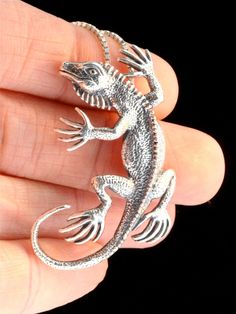 This solid sterling silver Iguana Pendant hugs you gently with its little lizard toes. It is intricately detailed and 1 3/4 of an inch long from the top of his head to the tip of his tail. This little guy is full of personality and would love to go scurrying home with you today. All Marty Magic Charms and Pendents include an 18 inch (46cm) box chain. If you would prefer a different length of chain please feel free to contact me. This item usually ships the same or next business day. All Marty Ma Ocean Ring, Magic Charms, Dragon Jewelry, Silver Dragon, Tree Pendant, Earring Tree, Jewelry Tree, Silver Necklaces, Ear Cuff