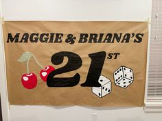 a sign that says maggie & brana's 21st birthday with dice and cherries