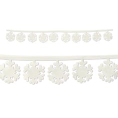 white snowflakes are hanging from the side of a string on a white background