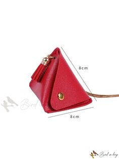 a small red purse with tassels on the front and side, measurements for it