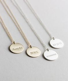 "Gold Circle Tag Necklace - Blank or Personalized. The Large Disk Necklace is a Simple, Everyday Staple. Have a custom made necklace stamped with a child's name, birthday, anniversary or something personal to keep close! Necklace: PERSONALIZED LARGE DISK D E T A I L S * 100% 14k Gold Filled, Sterling Silver, or 14k Rose Gold Filled * 16mm large disk * Choose the finish for your disk: smooth or hammered * Optional personalization - - - choose a letter style and short message I T ' S ∙ A W E S O M Everyday Round Disc Charm Necklace For Mother's Day, Everyday Mother's Day Charm Necklace With Round Disc, 14k Gold Name Necklace With Round Shape, Birthday Sterling Silver Round Name Necklace, 14k Gold Round Necklace With Name Detail, 14k Gold Round Necklace With Name, Minimalist Personalized Necklace For Everyday, 14k Gold Round Disc Charm Necklace, Minimalist Hand Stamped Necklaces For Birthday