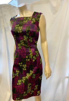 "1960s satin cocktail dress 36 bust 28 waist. Beautiful abstract print in green and purple. The dress has a high squared off neckline to front, broad pleathed straps, that go down the v-back line. Fitted silhouette the dress is fully lined it fastens with a centre back metal zipper. Below are the actual garment measurements, please compare them with something that fits you well. Measurements laid flat across, please double where appropriate. Bust 18.1/2 Waist 14\" Hips 19\" length 39\" Condition Fitted Purple Dress With Square Neck, Purple Fitted Dress With Square Neck, Retro Square Neck Party Dress, Fitted Silk Dress With Square Neck, Silk Fitted Dress With Square Neck, Fitted Retro Satin Dresses, Lined Mod Party Dresses, Retro Fitted Satin Dress, Retro Silk Lined Dresses