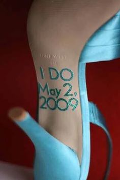 a blue shoe with the words i do may 2009 written on it's heel