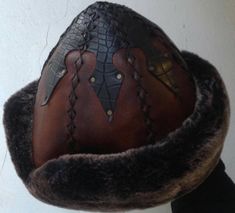 "Completely hand stitched Handmade This Leather hat is extremely thick and very warm.Made Genuine leather and Sheep Fur. Please be sure to measure the size of your head before buying. Measuring; Measuring for your head size is, You can use a tape measure (or a length of string that you will have to hold up to a tape measure) to determine the length. Place the string or tape around your head about 1/8\" above your ear, across the mid-forehead, completely circling your head. Hold the tape firmly, Heart Hats, Hat Outfits Summer, Medieval Items, Medieval Hats, Santa Claus Suit, Hat Outfits, Leatherworking Tools, Leather Hat, Hat Handmade