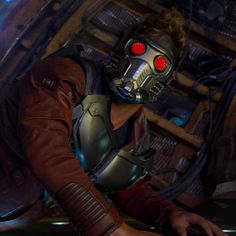 a man in a leather outfit with red eyes and a sci - fidget mask