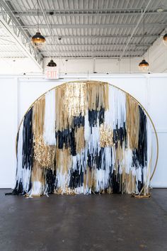 an art installation with gold and black paint