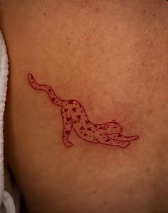 a tattoo on the back of a woman's stomach that has a cheetah design