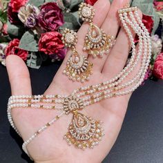 Featured is an all pearl jadau necklace set in 22k gold. The necklace can be worn both as a choker as well as a short necklace with tassle adjustment. The necklace weighs 30.40 gms including 17.71 gms in the stringing and hanging pearl beads The earrings weigh 11.65 gms including 1.17 gms in the hanging pearls. Price Breakup Summary Component Rupees % of Total 22k Gold 120,075 74.0% Stones & Beads 15,925 9.8% Making Charges 21,614 13.3% Taxes (GST) 4,728 2.9% Total 162,343 100.0% View Detailed B Jadau Necklace Set, Pearl Choker Set, 22k Gold Jewelry Necklaces, Jadau Necklace, Pearl Mala, 22k Gold Jewelry, Buy Pearls, Pearl Necklace Set, Gold Jewelry Necklace