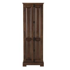 a tall wooden cabinet sitting on top of a white wall