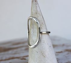 The path might lead you full circle, but look at the beautiful journey and how much you've grown. This ring uses a thick band and face, but the shape still makes it lightweight and easy to wear every day. A gorgeous statement ring. The comfortable ring face and the band are hammered with faceted texture. Created by hand in sterling silver, for you. Abstract Rings, Silver Oval Ring, Hammered Silver Ring, Simple Ring, Circle Ring, Ring Simple, Oval Ring, Oval Rings, Ring Minimalist