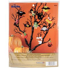 the halloween tree is made from plastic and has bats, owls, pumpkins, and other decorations on it