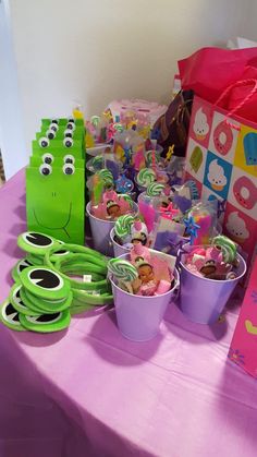 the table is set up with cupcakes, candy and other treats for children's birthday party