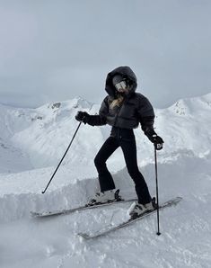 a person on skis standing in the snow