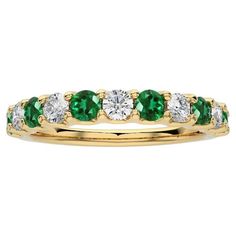 Gemstone Total Carat Weight: This exquisite 1981 Classic Collection wedding band ring features a total carat weight of 0.46 carats for 5 round diamonds and 0.5 carats for 6 round emeralds, creating a harmonious blend of sparkle and vibrant green hues. Gold Purity: Crafted with precision in luxurious 18k yellow gold, this wedding band ring weighs 2.83 grams, ensuring both durability and opulence. The yellow gold setting provides an elegant backdrop for the gemstones, enhancing their natural beaut Elegant Backdrop, Timeless Symbol, Green Hues, Yellow Gold Setting, Wedding Band Ring, Classic Ring, Vibrant Green, Classic Collection, Classic Elegance