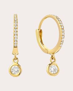 An elevated approach to traditional hoops, these huggie earrings decorate their 14-karat gold design with small channel-set diamonds. Larger bezel drops hang from the base to create head-turning shimmer. Hinge click closure 14k yellow gold and diamond Diamond carat: 0.17 ctw Polish with soft cloth Made in the USA Measurements Diameter: 0.43in Gold Diamond Hoop Earrings, Huggie Earrings Gold, Diamond Carat, Diamond Hoop Earrings, Huggie Earrings, Women Diamond, Channel Set, Gold Design, Huggies Earrings