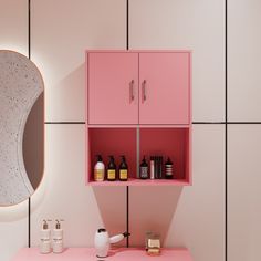 a bathroom with pink cabinet and mirror