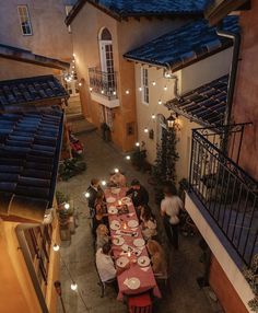 an overhead view of a restaurant with people sitting at the tables and eating dinner outside