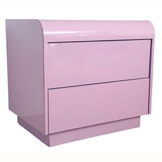 a pink dresser sitting on top of a white floor