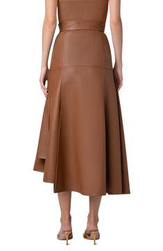 The brand's tailoring expertise is apparent on this asymmetric lambskin-leather skirt with slanting seams always angling toward signature trapezoid shapes. Hidden side-zip closure Hidden side-zip pocket Leather Professional leather clean Made in Switzerland Designer Clothing Brown Leather Skirt, Crepe Skirts, Cotton Midi Skirt, Latest Skirts, Leather Midi Skirt, Knit Midi Skirt, Midi Skirt Pencil, Black Midi Skirt, Denim Midi Skirt