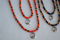 These fun and unique necklace and bracelet sets make a great addition to any Halloween costume. They are very nice and well made so you can wear them out or to the office to show that you are in the Halloween spirit and they will last for years. These jewelry sets also make a wonderful gift or party favor for your Halloween guests. The necklaces and bracelets are made with stretchy beading cord so this allows some flexibility in fit. I can make them to your desired length and also add a chain ex Halloween Gift Beaded Necklaces With Round Beads, Halloween Gift Beaded Necklace With Round Beads, Halloween Gift Round Beads Necklace, Handmade Beaded Necklaces For Halloween Gift, Halloween Gift Jewelry With Round Beads, Handmade Adjustable Jewelry For Costume Party, Halloween Beads, Halloween Necklace, Beading Cord