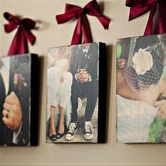 an image of three pictures hanging on the wall with red ribbon and bow around them