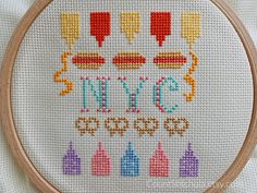 a cross stitch pattern with the words nyc and hotdogs in different colors on it