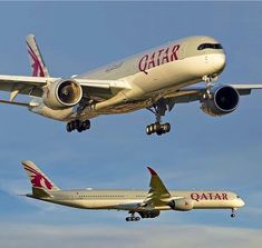 an airplane is flying in the air with another plane below it and one on the ground