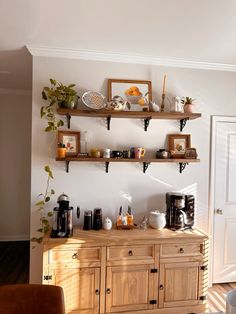 a kitchen with wooden cabinets and shelves filled with food