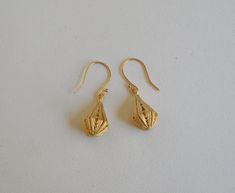 Lovely 24 x 12mm 24Kt gold plated brass filigree teardrops with a satin finish dangle from 17mm gold plated brass ball hook ear wires for an overall drop length of 1-1/2 inches. A travel pouch and gift box are included with every purchase. #1806 Gold Teardrop Pierced Earrings, Gold Brass Long Drop Teardrop Earrings, Gold Teardrop Drop Earrings, Handmade Gold Teardrop Earrings, Handmade Gold Teardrop Pendant Earrings, Gold Teardrop Earrings As Gift, Gold Teardrop Pendant Earrings With Ear Wire, Gold Teardrop Earrings With Lever Back As Gift, Filigree Brass Teardrop Earrings