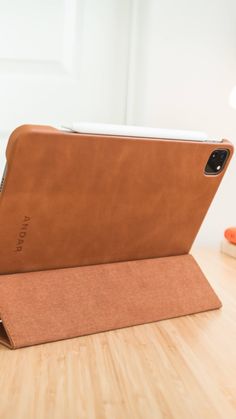 an ipad case sitting on top of a wooden table