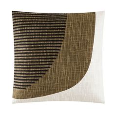 a brown and black pillow on a white background