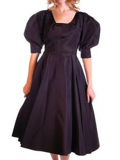 This gorgeous vintage black silk faille cocktail dress features really great full balloon sleeves- they are meant to be pushed up on the arm for a full balloon effect. They have generous armholes. It has a very uniquely gored bodice/skirt, with a full back zip. Flattering square neckline. It has an inner belt, where the label resides. It is unlined. It has a Blum's-Vogue label ( an exclusive high end Ladies Store popular in Chicago in the 40s and 50's ). It is possible this is an unlabeld design Black Puff Sleeve Dress For Evening With Fitted Bodice, Evening Puff Sleeve Dress With Fitted Bodice, Voluminous Puff Sleeve Dress With Square Neck For Evening, Evening Puff Sleeve Dress With Balloon Sleeves, Evening A-line Puff Sleeve Dress, Formal Puff Sleeve Dress With Pleated Bodice, Evening Fitted Puff Sleeve Dress With Pleated Bodice, Fitted Vintage Puff Sleeve Dress For Party, Voluminous Puff Sleeve Evening Dress, Knee-length