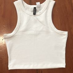 This H&M Ribbed Tank Top Is Brand New, Never Worn. It Has An Athletic Material So You Can Wear It Working Out, Or As A Casual Going Out Piece. It Is Tight Fit And Cropped. H&m Ribbed Stretch Tops, Basic White Ribbed Crop Top, Fitted Cotton Tank Top By H&m, Fitted Cotton H&m Tank Top, H&m Cotton Fitted Tank Top, H&m White Tank Top For Spring, White H&m Tank Top For Spring, H&m Cotton Casual Crop Top, H&m White Spring Tank Top