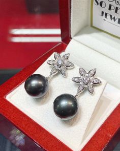 "EXTREMELY SHINY, AUTHENTIC LUSTROUS BLACK TAHITIAN PEARLS! Dangling earrings! Perfect for any occasion! We are presenting you A PAIR OF matching TAHITIAN PEARLS with natural, LUSTROUS BLACK color. SET IN HANDCRAFTED, 18K SOLID GOLD DROP EARRINGS. ACCENTED WITH 38 F/VS, SPARKLING ROUND BRILLIANT DIAMONDS! Extremely elegant and tasteful! The pearls are so lustrous and shiny! The design is chic and elegant. Simple and classy! Dangling with just enough length to show that you're important! With spa Black Diamond Earrings For Wedding, Elegant Tahitian Pearl Earrings For Wedding, Luxury Tahitian Pearl Wedding Earrings, Elegant Gray Earrings For Gift, Elegant Gray Earrings As Gift, Luxury Gray Jewelry For Formal Occasions, Gray Luxury Jewelry For Formal Occasions, Formal Gray Tahitian Pearl Jewelry, Tahitian Pearl Round Earrings For Wedding