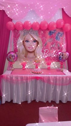 a barbie birthday party with pink decorations and balloons