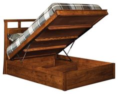 a wooden bed frame with a mattress and pull out storage compartment in the bottom section