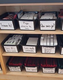 the shelves are filled with many different types of file folders and binder boxes