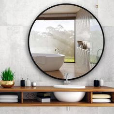 a bathroom with a sink, mirror and bathtub on the counter top in front of it